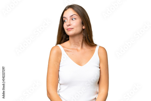 Young pretty woman over isolated background making doubts gesture looking side