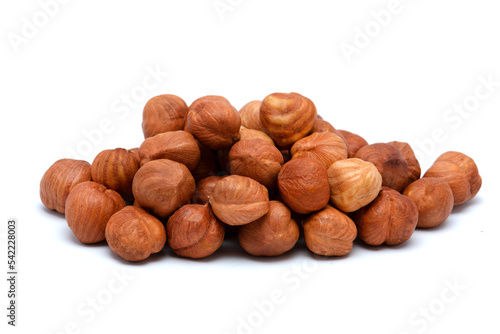 Beautiful toasted hazelnuts isolated on a white background