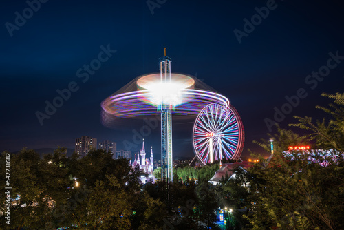 Beijing Shijingshan Amusement Park Ferris Wheel Rotating Flying Chair Night Lights photo