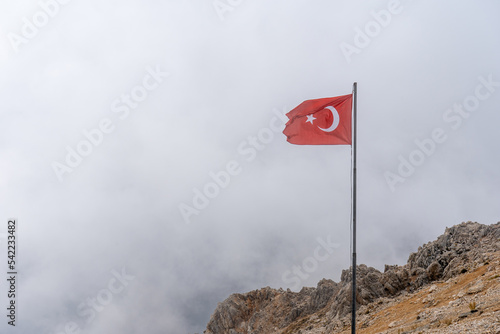 Turkish flag on the Tahtali Mountain in the Clouds