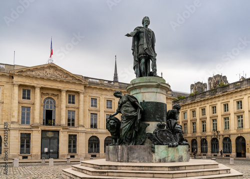 view of the Place Royal Square in downtown Reims with the statue of Louis XV in Roman garb