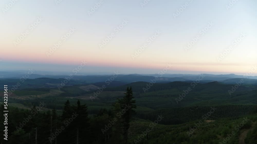 Wide aerial above Tillamook State Forest in Oregon during blue hour sunset Wide aerial above Tillamook State Forest in Oregon during blue hour sunset