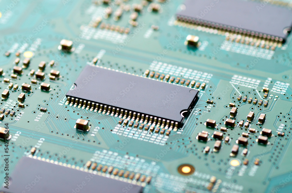 microchips and electronic components on the board close-up, soft focus microchips and electronic components on the board close-up, soft focus