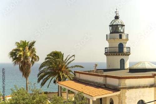 Lighthouse on the seashore. Palms. Spain. Summer © DMITRY