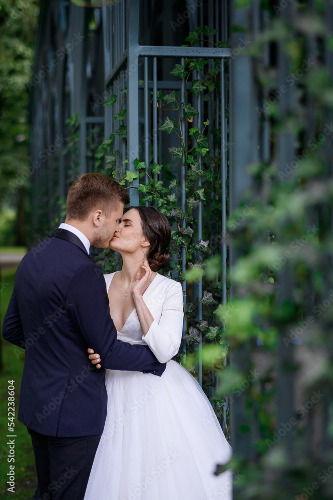 Loving brides couple young man snd woman kissing enjoying wedding day ...
