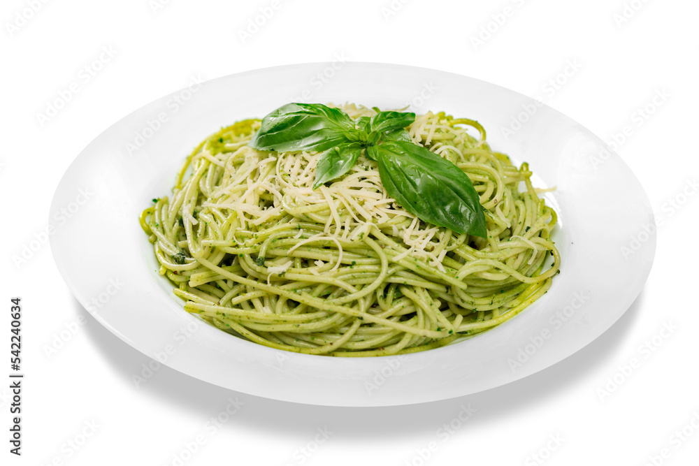 Italian pasta spaghetti with pesto sauce and basil leaf close-up