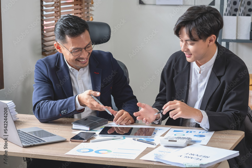 Team of business use calculators and graph analysis computer laptop tablets to plan marketing strategies and make profitable investments for the company. Team of business use calculators and graph analysis computer laptop tablets to plan marketing strategies and make profitable investments for the company.