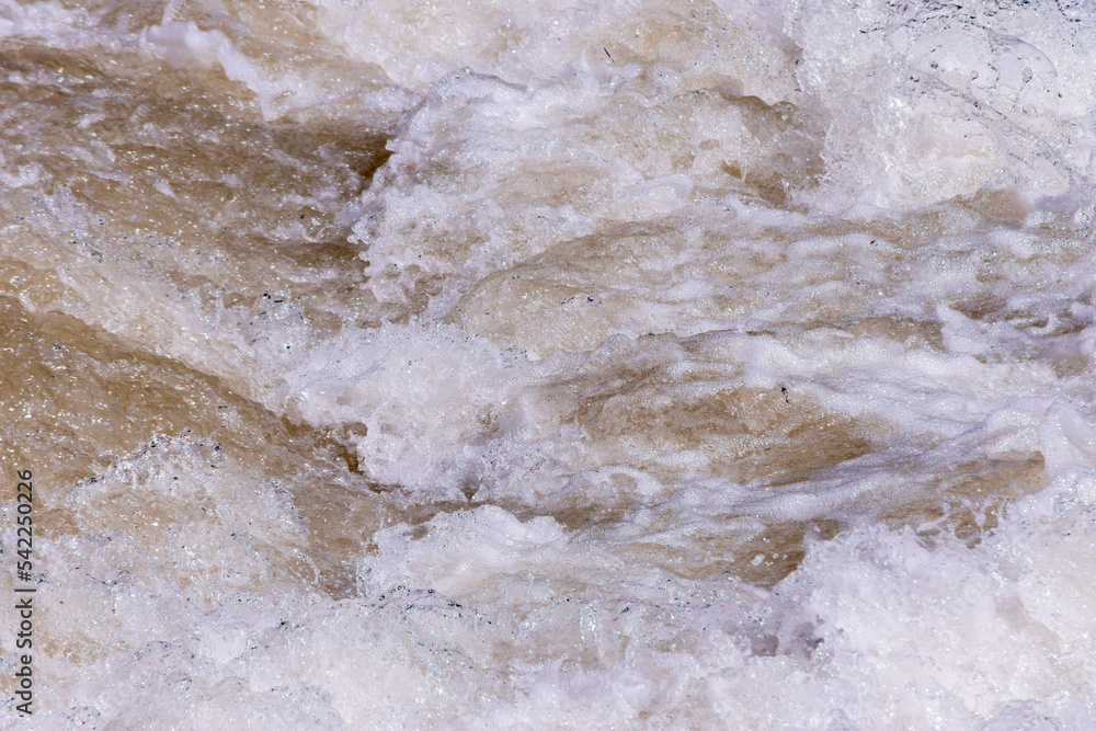 Close up to water foam texture in the rapid section of a river Close up to water foam texture in the rapid section of a river