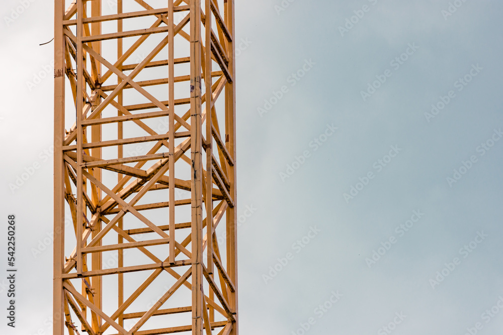 Yellow scaffolding of a crane with safety stairs inside to gain access in case of emergency Yellow scaffolding of a crane with safety stairs inside to gain access in case of emergency