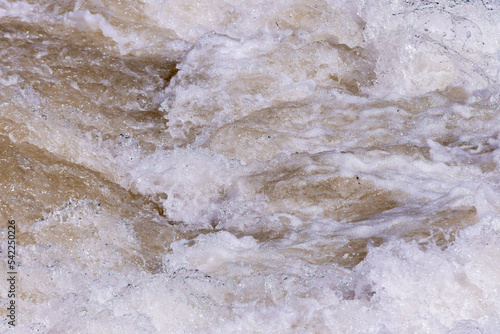Close up to water foam texture in the rapid section of a river