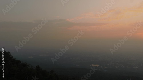 Drone pan while it goes down revealing amazing sunrise over the city of Chiang Mai in Thailand photo