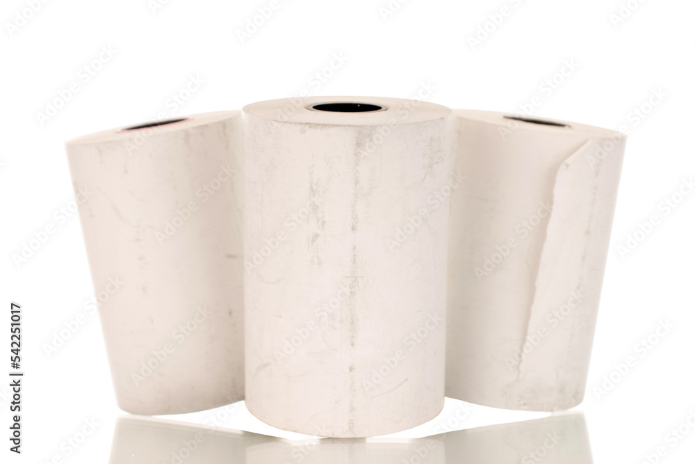 Three rolls of paper cash register tape, close-up isolated on white. Three rolls of paper cash register tape, close-up isolated on white.