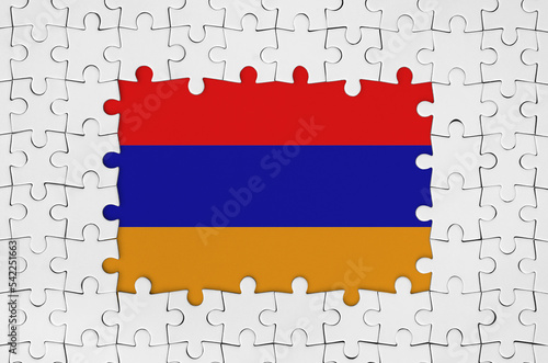 Armenia flag in frame of white puzzle pieces with missing central part photo