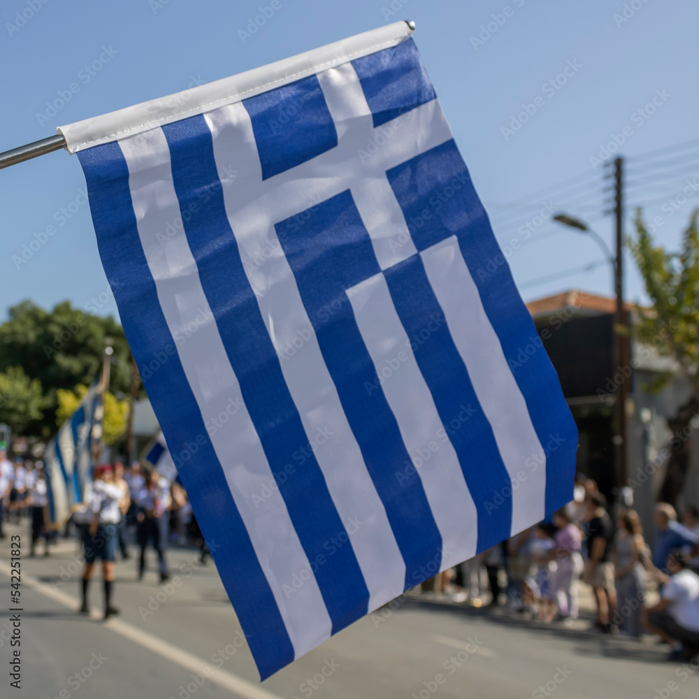 Naklejka premium Close-up of Greek flag in front of Ohi Day parade in Limassol, Cyprus