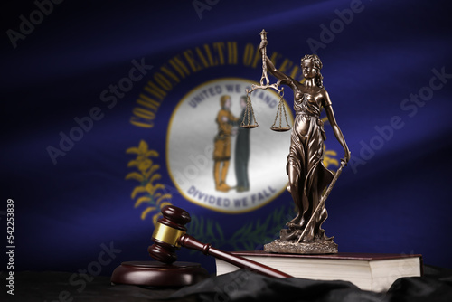 Kentucky US state flag with statue of lady justice, constitution and judge hammer on black drapery. Concept of judgement and guilt