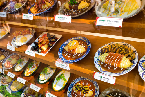 Canvas Print Showcase of fake dish displayed in front of restaurant, Daehagno student distric
