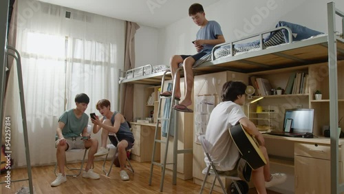 Young Chinese university students relaxing in dormitory,4K