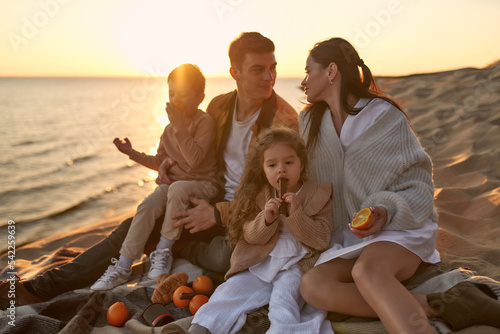Family on the beach in autumn
