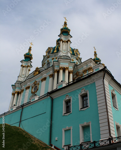 The blue facade of the Church of St. Andrew in Kyiv against the background of the blue sky. Andriyivskyi Uzviz in Kyiv. Architectural monument. Religious buildings.
