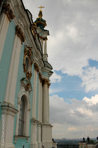 The blue facade of the Church of St. Andrew in Kyiv against the background of the blue sky. Andriyivskyi Uzviz in Kyiv. Architectural monument. Religious buildings.