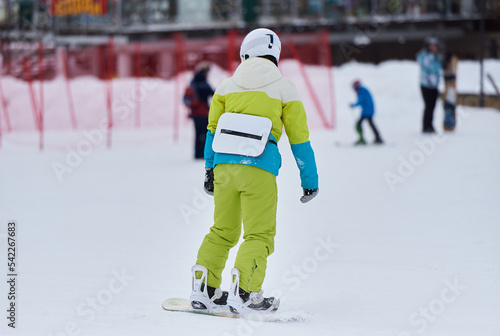 Snowboarder with back protection for safety rides