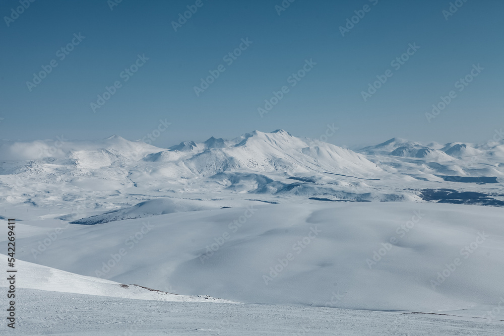 Caucasian mountains covered with snow on a sunny day