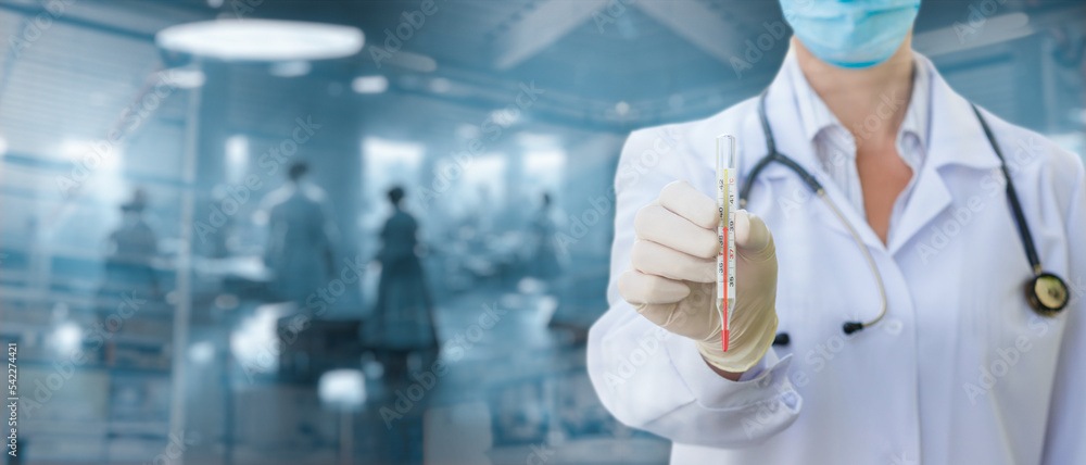 Doctor shows a thermometer with a temperature . Doctor shows a thermometer with a temperature .