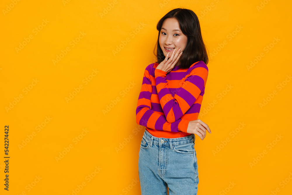 Asian brunette woman smiling and looking at camera Asian brunette woman smiling and looking at camera