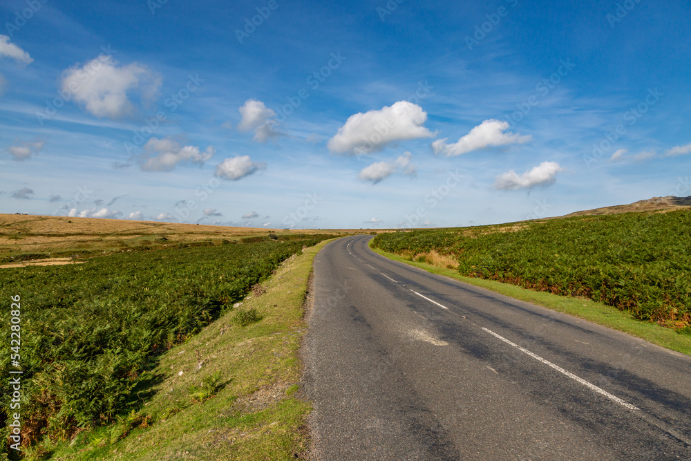 A Road in Dartmoor National Park in Devon, with a Blue Sky Overhead