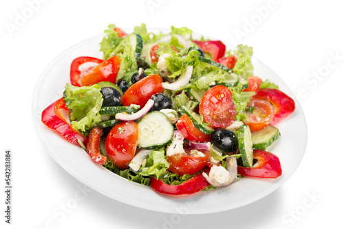 Greek salad with fresh vegetables on background