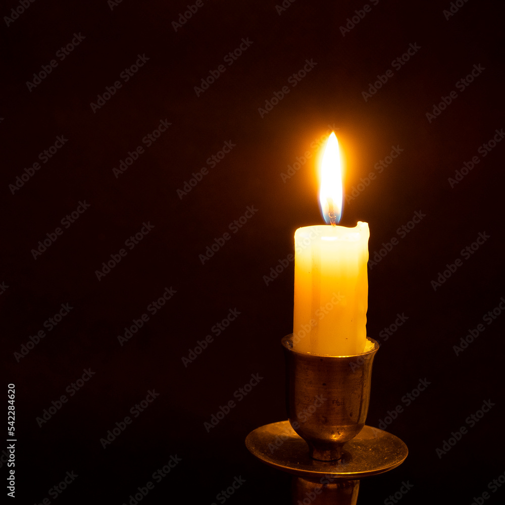white burning candle on a black background, blackout white burning candle on a black background, blackout