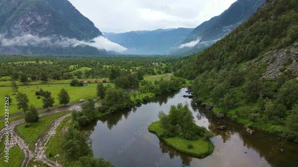 Aerial: The southern shore of Teletskoye Lake in cloudy weather Aerial: The southern shore of Teletskoye Lake in cloudy weather