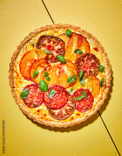 Tomato pie on yellow surface