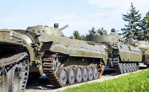 A column of armored vehicles and tanks. National Armed Forces. Military equipment and troops. War in Ukraine. Building or building combat vehicles. Armored weapons. means of the armed forces.