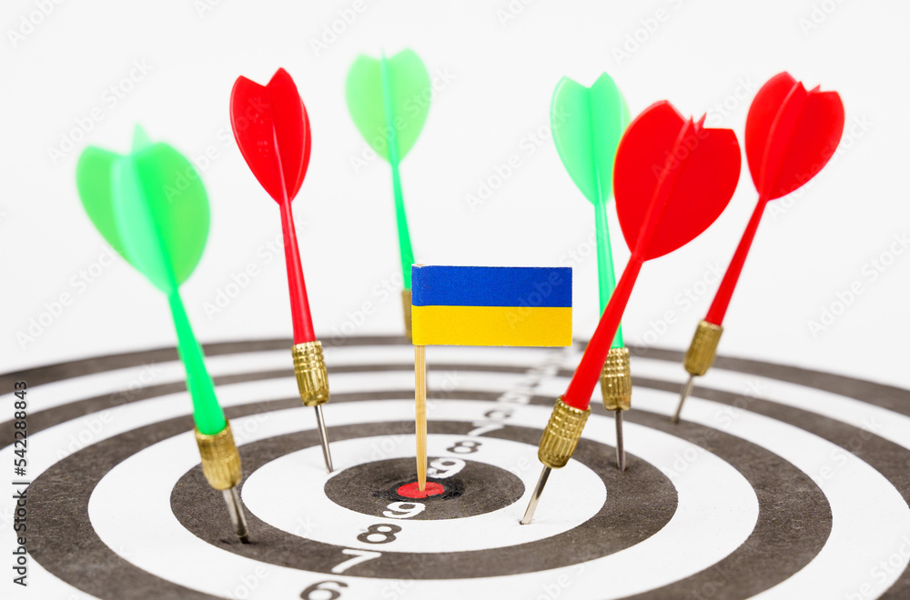 Darts with the flag of Ukraine in the bullseye, next to red and green darts. Darts with the flag of Ukraine in the bullseye, next to red and green darts.