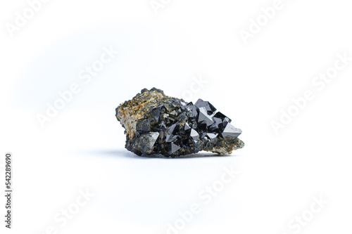 Fotografie Magnetite (natural magnet, iron ore) macro detail white isolated background