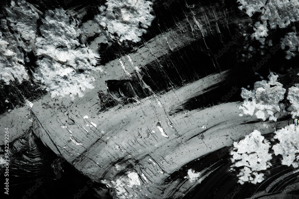 Fototapeta premium snowflake obsidian (white cristobalite crystals) obsidian macro detail texture background. close-up raw rough unpolished semi-precious gemstone