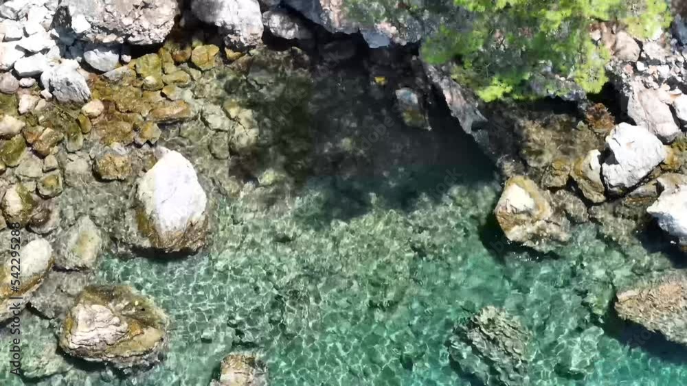Aerial shot of a clear calm seawater texture over rocks in DalyanTurkey Aerial shot of a clear calm seawater texture over rocks in DalyanTurkey