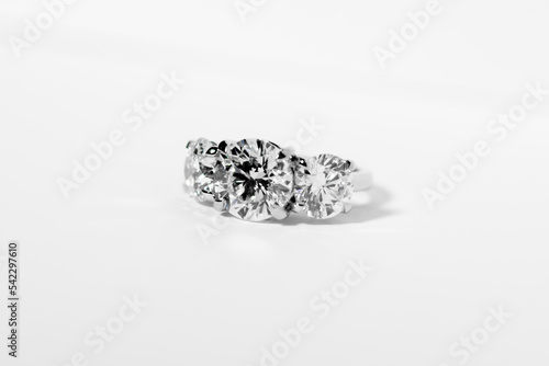 Beautiful diamond ring on a white background - concept of wedding and engagement