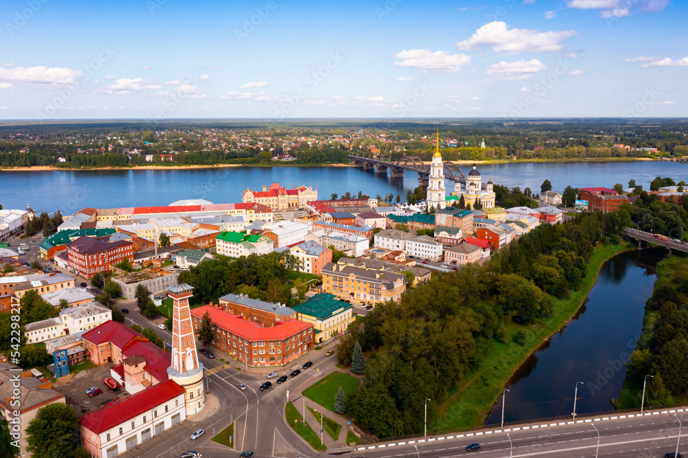 Aerial view of the administrative center of the city of Rybinsk with the Transfiguration Cathedral, as well as the original ..road bridge over the Volga River on a summer day, Russia