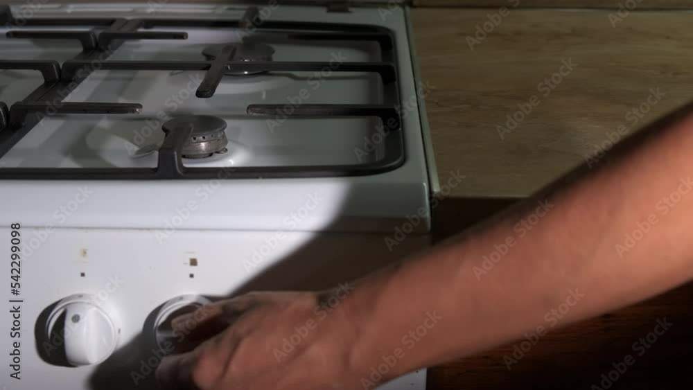 Energy crisis. No gas. A woman is trying to turn on the gas on a gas stove. Gas sanctions. Energy crisis. No gas. A woman is trying to turn on the gas on a gas stove. Gas sanctions.