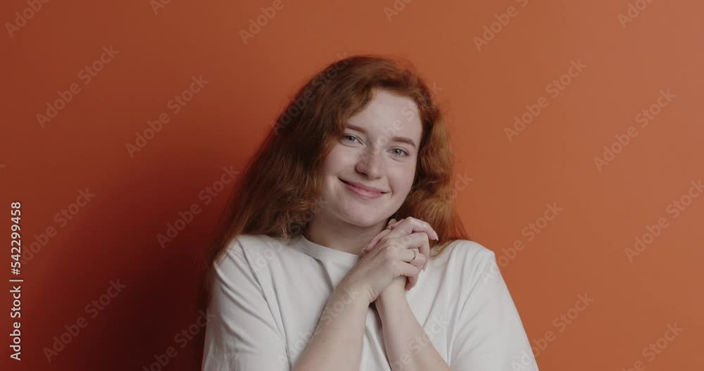 Redhaired woman smiling camera. Positive girl smiling sincerely, feeling happy Redhaired woman smiling camera. Positive girl smiling sincerely, feeling happy