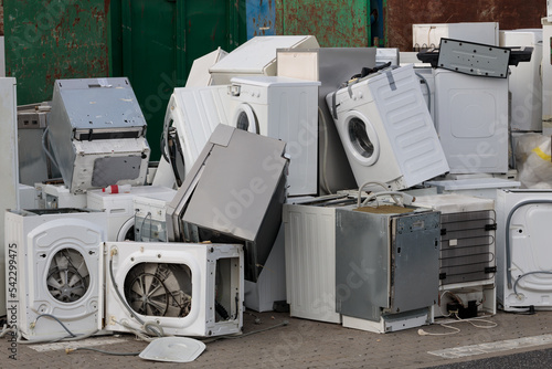 Collected and awaiting for the disposal of electronic-waste - refrigerators, washing machines and others. Close-up