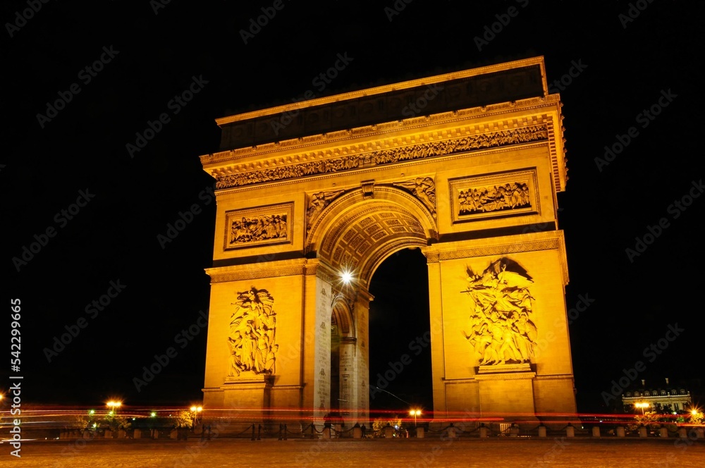 Arch of the Triumph in Champs Elysee, Paris, France captured at night lights