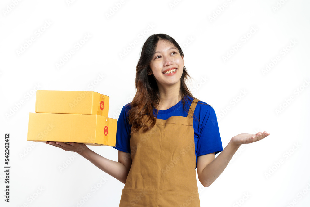 Young pretty asian woman with apron holding packages box of product for delivery sme entrepreneur owner isolated on white background.