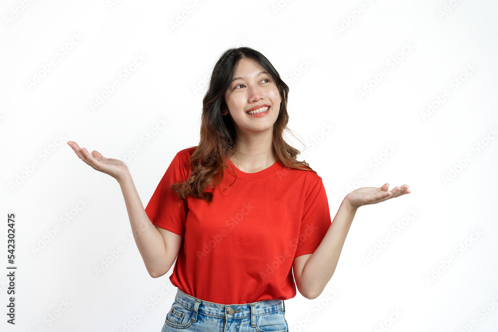 Happy pretty young asian woman red t-shirt isolated white background. palm up Happy pretty young asian woman red t-shirt isolated white background. palm up