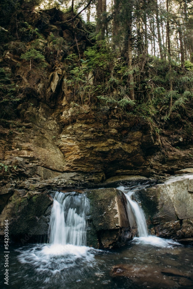 Fototapeta premium Vertical view of the Girl's Tears waterfall in the Ivano-Frankivsk region, Ukraine
