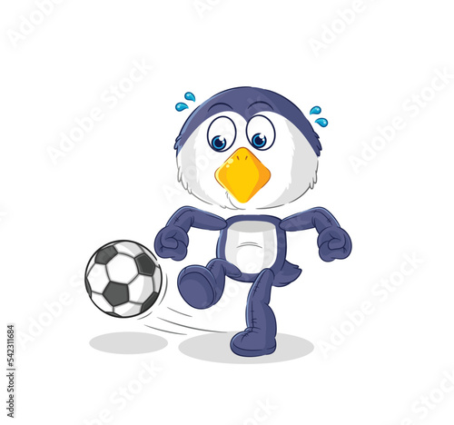 penguin kicking the ball cartoon. cartoon mascot vector