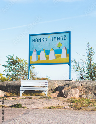 View of Hanko town coast, Hango, Finland, with beach and coastal waterfront, wooden houses and beach changing cabins, Uusimaa, Hanko Peninsula, Raseborg sub-region, summer sunny day photo