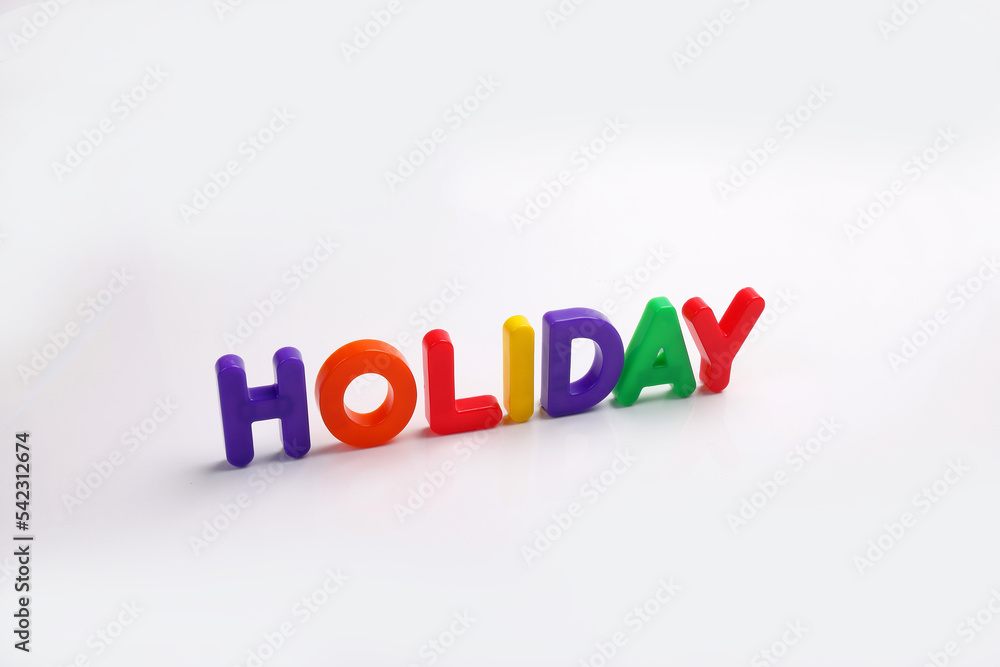red green blue yellow plastic toy capital font letter alphabet holiday on white background copy text space concept red green blue yellow plastic toy capital font letter alphabet holiday on white background copy text space concept